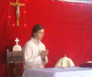 Praying before Communion at a Liturgy in Lequitura.